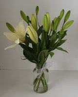 Asiatic Lily In Small Glass Vase.