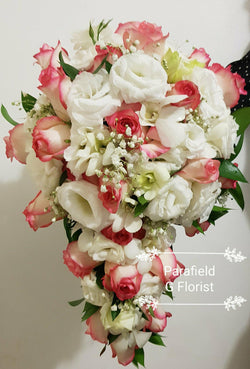 Teardrop bridal Rose and Lisianthus bouquet.